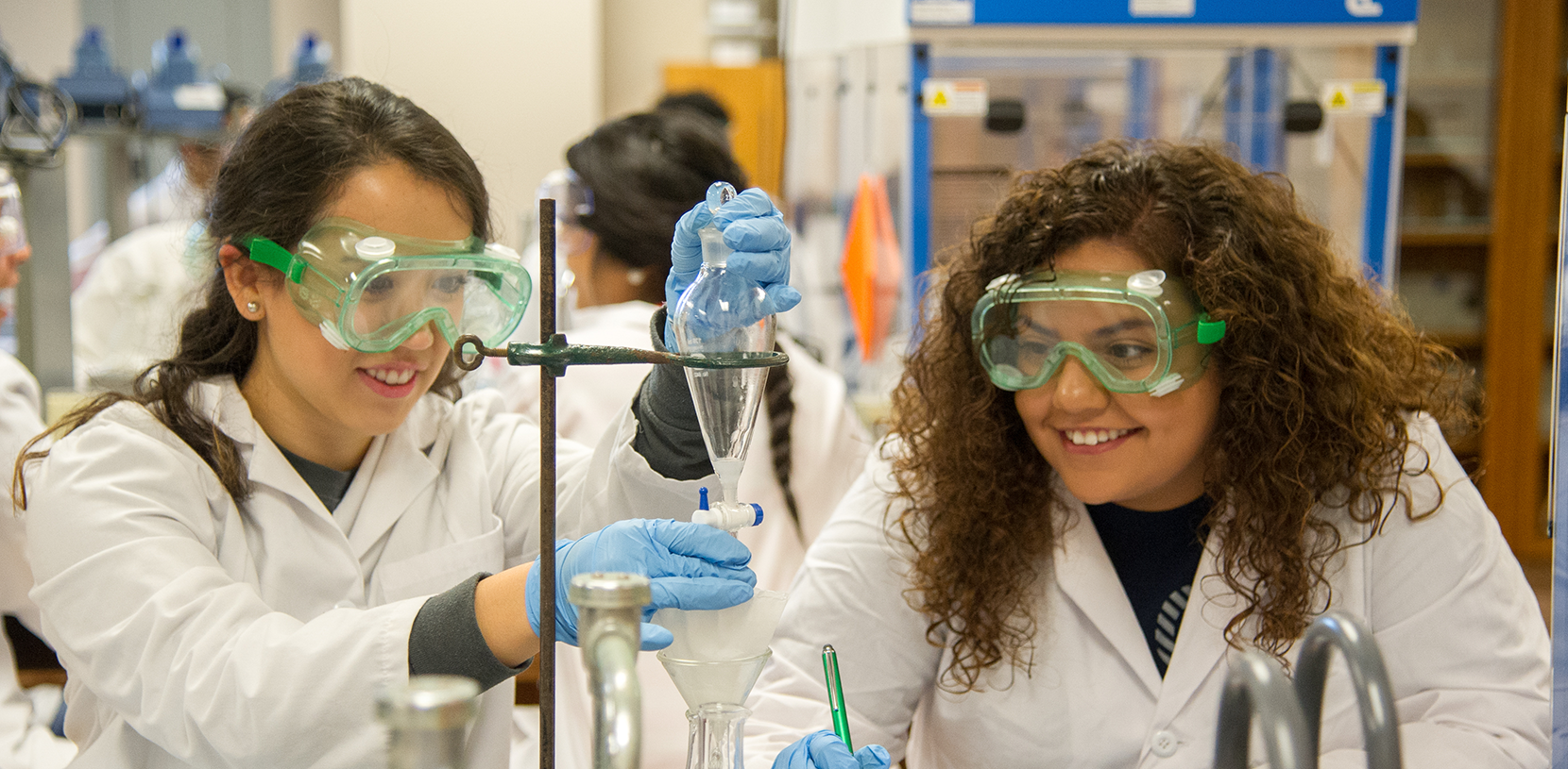 Students in a chem lab working on a project