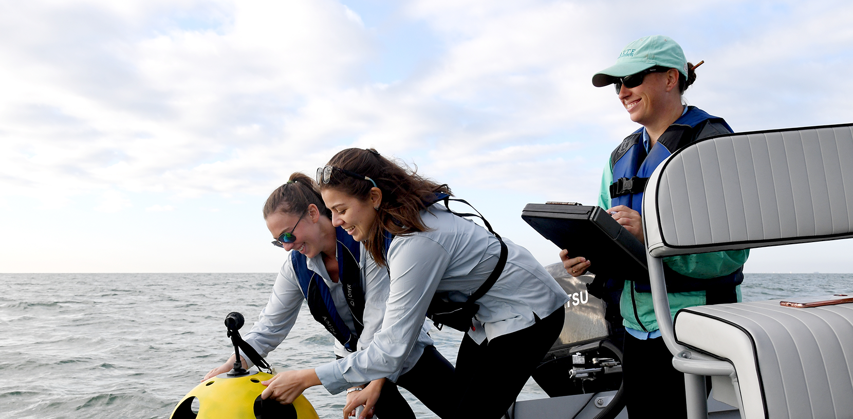 HRI Bay trip - students on a boat at sea